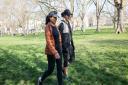Two women walking in Highbury Fields - part of a push by Camden and Islington Councils to get people out into parks more