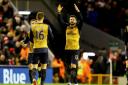Olivier Giroud (right) celebrates his first goal of the game against Liverpool