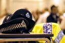 A Met police officer and eight co-defendants have been charged with bribery offences