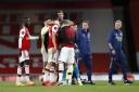 Arsenal goalkeeper Emiliano Martinez celebrates with team-mates Granit Xhaka and Alexandre Lacazette after their win over Liverpool