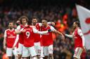 Arsenal's Alexandre Lacazette (centre) celebrates with team-mates after his side's first goal of the game is re-allowed through VAR during the Premier League match at the Emirates Stadium, London. Picture: Bradley Collyer/PA