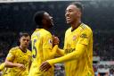 Arsenal's Pierre-Emerick Aubameyang (right) celebrates scoring his side's first goal of the game with team mate Ainsley Maitland-Niles during the Premier League match at St James' Park, Newcastle. Picture: OWEN HUMPHREYS/PA