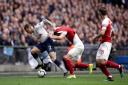 Tottenham Hotspur's Kieran Trippier (left) and Arsenal's Aaron Ramsey battle for the ball during the Premier League match at Wembley Stadium, London. PA