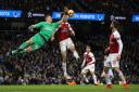 Arsenal goalkeeper Bernd Leno blocks a shot during the Premier League match at the Etihad Stadium, Manchester. PA