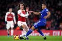 Arsenal's Matteo Guendouzi (left) and Cardiff City's Lee Peltier battle for the ball (pic Nick Potts/PA)