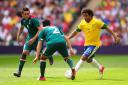 Brazil's Marcelo in action with Mexico's Israel Sabdi Jimenez Nanez (centre) and Hector Herrera Rubio (left). PA