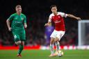 Vorskla's Vladyslav Kulach (left) and Arsenal's Mesut Ozil in action at the Emirates Stadium earlier this season (pic Nick Potts/PA)