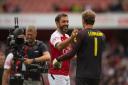 Arsenal Legends' Robert Pires (left) congratulates teammate Jens Lehmann at the final whistle of the Legends match at the Emirates Stadium, London.