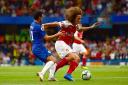 Arsenal's Matteo Guendouzi (right) and Chelsea's Pedro (left) battle for the ball during the Premier League match at Stamford Bridge, London. PA.