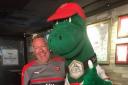 Arsenal fan John Williamson in Singapore with Gunnersaurus. CREDIT JOHN WILLIAMSON