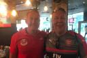Loyal Arsenal fan John Williamson in Singapore with Ray Parlour. CREDIT JOHN WILLIAMSON