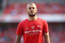 Arsenal's Jack Wilshere wearing a 'Merci Arsene' t-shirt before the Frenchman's last home match in charge of the club against Burnley (pic Nick Potts/PA)