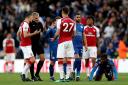 Arsenal's Konstantinos Mavropanos (27) is sent off by match referee Graham Scott during the Premier League match at the King Power Stadium, Leicester.