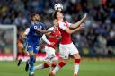 Arsenal's Rob Holding (right) and Leicester City's Riyad Mahrez (left) battle for the ball during the Premier League match at the King Power Stadium, Leicester.