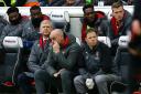 Arsenal manager Arsene Wenger and staff look on (pic Gareth Fuller/PA)
