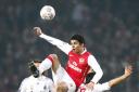 Arsenal's Da Silva Eduardo and AC Milan's Gennaro Gattuso battle for the ball