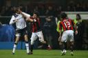AC Milan's Gennaro Gattuso (centre) pushes Tottenham Hotspur's Peter Crouch (left) during the match