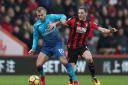 Arsenal's Jack Wilshere (left) holds off Bournemouth's Dsan Gosling during the Premier League match at the Vitality Stadium, Bournemouth.