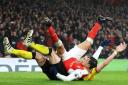 Alexis Sanchez  tussles with Watford's Sebastian Prodl during Arsenal's 2-1 defeat on Tuesday