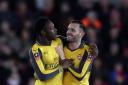 Arsenal's Danny Welbeck celebrates scoring his side's second goal of the game with teammate Arsenal's Lucas Perez during the Emirates FA Cup, fourth round match at St Mary's Stadium, Southampton.
