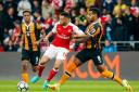 Arsenal's Francis Coquelin and Hull City's Tom Huddlestone battle for the ball during the Premier League match at the KCOM Stadium, Hull. Danny Lawson/PA Wire/Press Association Images