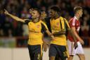 Arsenal's Lucas Perez (left) celebrates scoring his side's third goal of the game at Nottingham Forest.