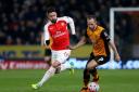 Arsenal's Olivier Giroud and Hull City's David Meyler battle for the ball (Tim Goode/PA Wire)