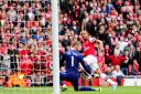 Arsenal's Theo Walcott scores the opening goal past Manchester United's David De Gea. Photo: Adam Davy/PA Wire
