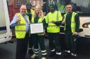 Catherine with Glen Witby (left) and his waste and recycling team. Picture: Hackney Council