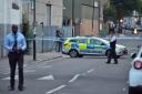 Police at the scene of the stabbing in Fairbridge Road. Picture: John Stillwell/PA Wire