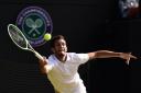James Ward in action during his third-round match against Vasek Pospisil at Wimbledon