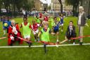 Pitch invasion - Islington Mayor Barry Edwards joins young footballers, Hannah Bladen orf Sport England and Cllr Janet Burgess