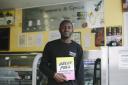 Riaz Phillips with his book at Pepper and Spice in Dalston. Picture: Riaz Phillips
