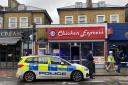 A police cordon was still in place outside Chicken Express in Seven Sisters Road at 1pm today (December 10)