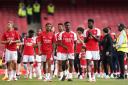 Arsenal players enjoy a lap of honour after their last game of the season