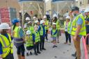 Beats the classroom... children get lesson on building site