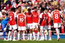 Arsenal players huddle before their match against Fulham