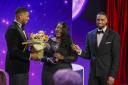 Pride of Britain Prince's Trust Young Achiever Tskenya-Sarah Frazer. is handed flowers by boxer Anthony Joshua at Monday's ceremony which was co-hosted by Ashley Banjo and Carol Vorderman.