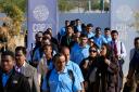 People walk through the venue at the COP28 U.N. Climate (AP Photo/Rafiq Maqbool)