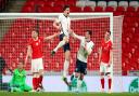 England's Harry Maguire celebrates scoring against Poland at Wembley Stadium