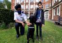 Camden and Islington's head of police, Chief Superintendent Raj Kohli (left), and eight-year-old hospital visitor Stefan Jenner - with PD Dexter