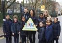 Pupils and staff at St John Evangelist Catholic Primary School, which has Islington's first School Street, with Cllr Claudia Webbe. Picture: Steve Bainbridge