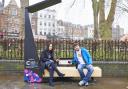 Happier times: Cllr Claudia Webbe tests out one of the smart benches near Islington Green in January. Picture: Simon Way