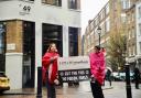 Two Extinction Rebellion activists outside the offices of Hill and Knowlton Strategies