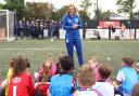 England manager Sarina Wiegman talks to youngsters on the day of her World Cup squad announcement