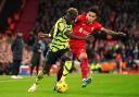 Arsenal's Bukayo Saka attacks against Liverpool