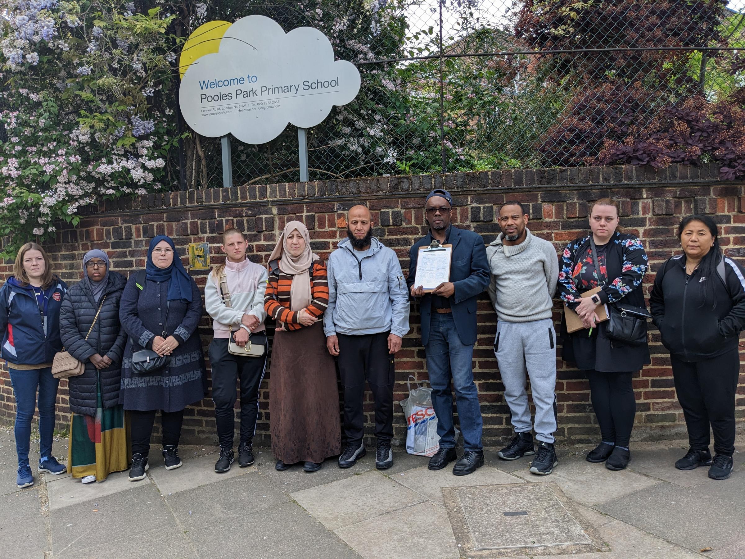 Concerned parents of pupils at Pooles Park Primary School, Lennox Rd, Islington. Parent Paul Levy- Adophy holds petition. Photo: Julia Gregory