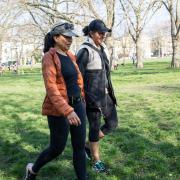Two women walking in Highbury Fields - part of a push by Camden and Islington Councils to get people out into parks more