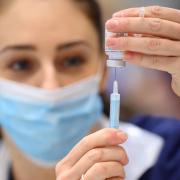 Medical staff preparing shots of a Covid-19 vaccine