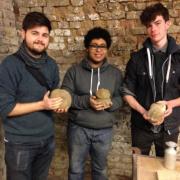 Teacher Joshua Alford and pupils Raul Simmons-Perez, 16, and Nico Zavrou Blackstock, 16, from East Barnet School, Barnet, with their clay figures. Picture: Erica Spurrier/Equity